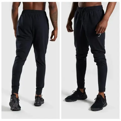Model in black tapered joggers with ribbed cuffs, shown from front and side